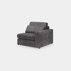 Grey modular corner sofa with plush cushions and right armrest, modern living room seating