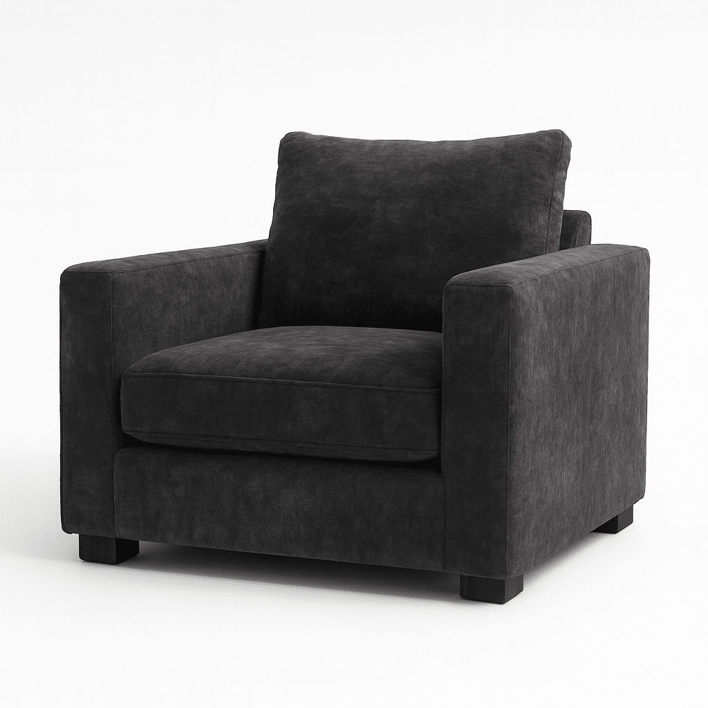 Modern grey velvet armchair with plush cushions and square arms on short black legs