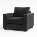 Modern grey velvet armchair with plush cushions and square arms on short black legs