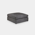Modern grey fabric footstool ottoman with clean lines on a plain background
