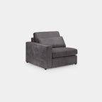 Modern grey modular sofa section with one armrest and plush cushions on white background