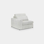 Bouclé cream modular sofa middle piece with armrest and plush cushions on white background