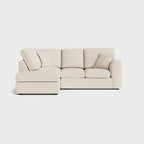 Cream right corner sofa with chaise, modern design, three seat cushions, and scatter pillows