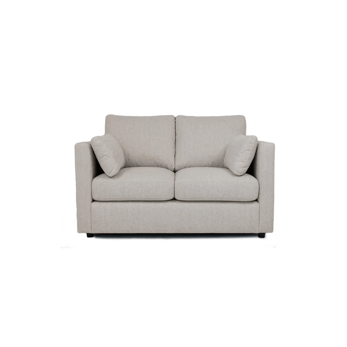 Modern cream two-seater sofa with plush cushions and armrests, upholstered in fabric.