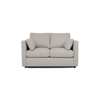 Modern cream two-seater sofa with plush cushions and armrests, upholstered in fabric.