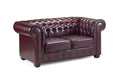 Chesterfield leather 2 seater sofa in oxblood red with deep button tufting and rolled arms