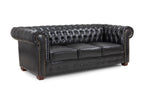 Black leather Chesterfield 3-seater sofa with button-tufted back and rolled arms