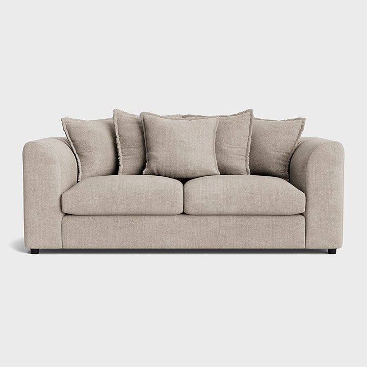 Modern cream fabric sofa with plush cushions and rounded arms on a light background