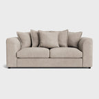 Modern cream fabric sofa with plush cushions and rounded arms on a light background