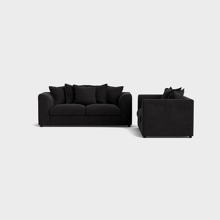 Modern black sofa set with plush cushions on a light background, contemporary living room furniture