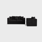 Modern black sofa set with plush cushions on a light background, contemporary living room furniture