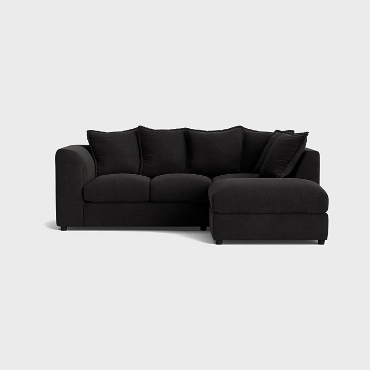Modern black left corner sofa set with plush cushions on white background