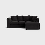 Modern black left corner sofa set with plush cushions on white background