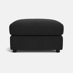 Modern black upholstered ottoman with short legs on a white background