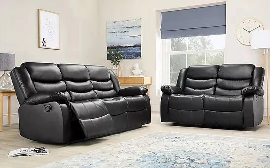 Black leather reclining 3-seater sofa and loveseat in modern living room setting