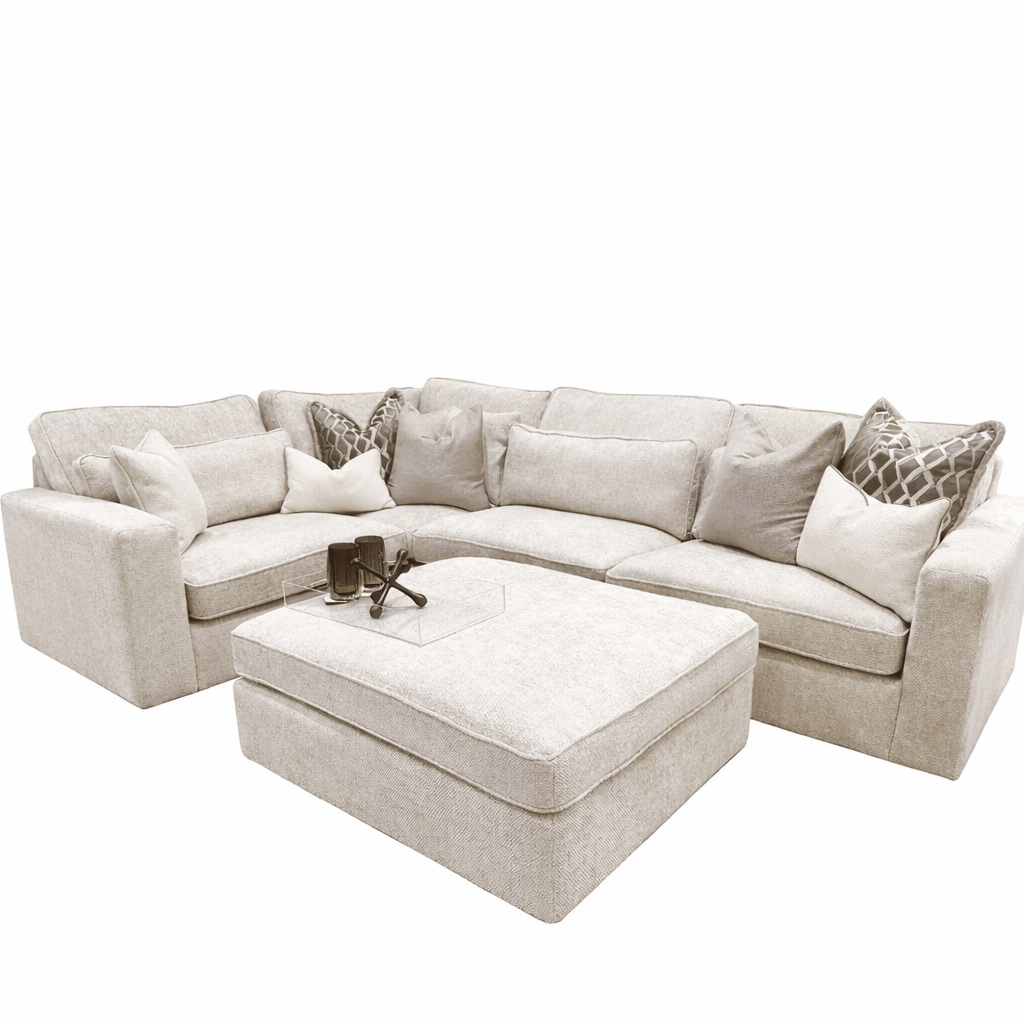 Oatmeal 4-piece corner sofa with ottoman and assorted cushions in neutral living room setting