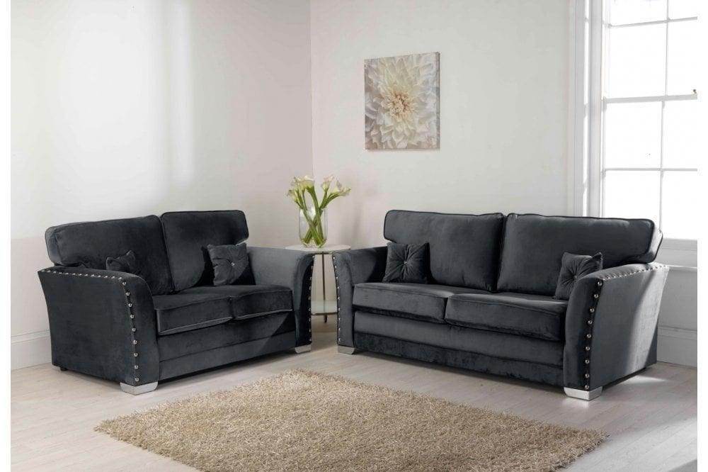 Black velvet 3 and 2 seater sofa set with studded arms in modern living room