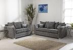Grey fabric 3 seater and 2 seater sofas in modern living room with decorative cushions