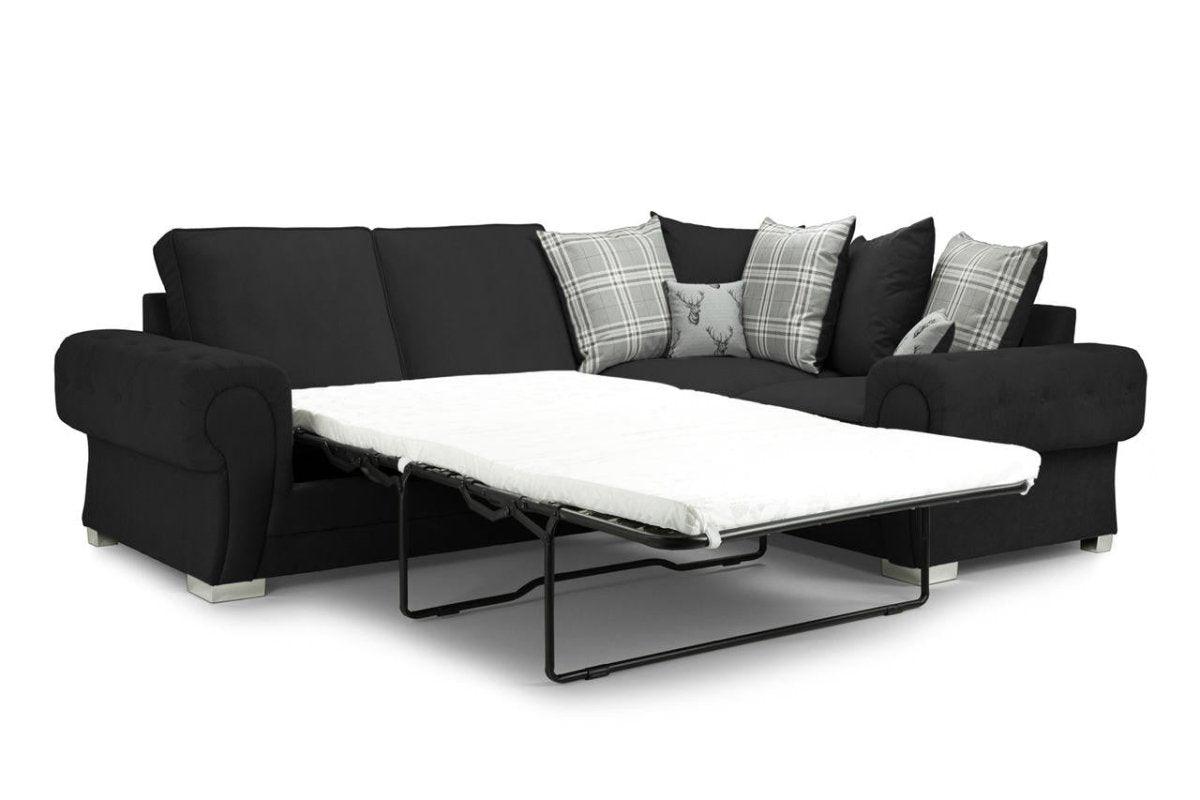 Black left-facing corner sofa bed with plaid and deer print scatter cushions on white background
