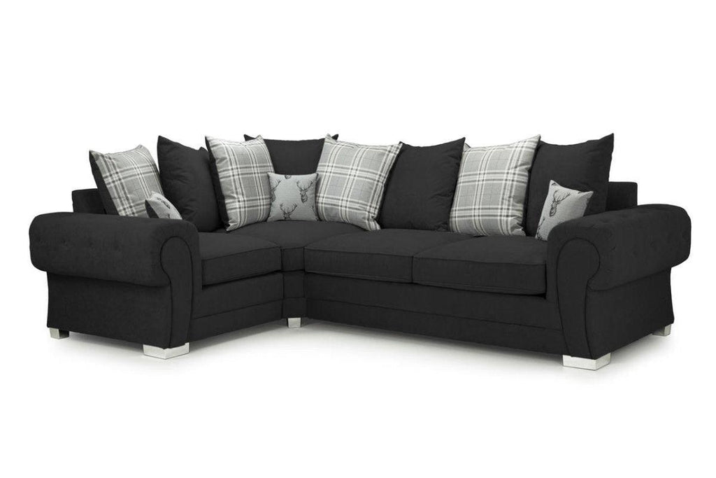 Black right facing corner sofa bed with fullback and scatter cushions, plaid and stag designs