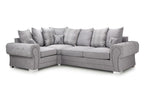 Light grey corner sofa with scatter back cushions and plaid accent pillows