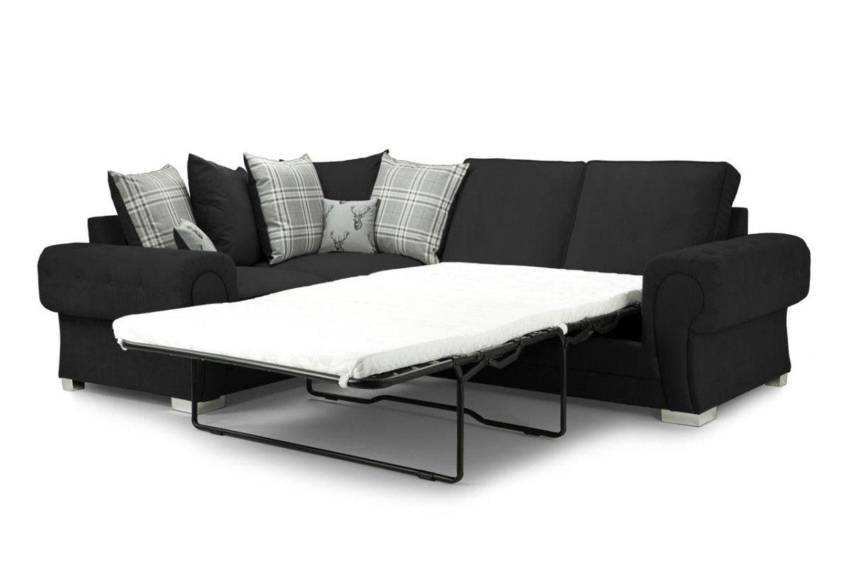 Black corner sofa bed with plaid and stag scatter cushions, right-facing design