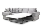 Grey right-facing corner sofa with pull-out bed, plaid and stag scatter cushions