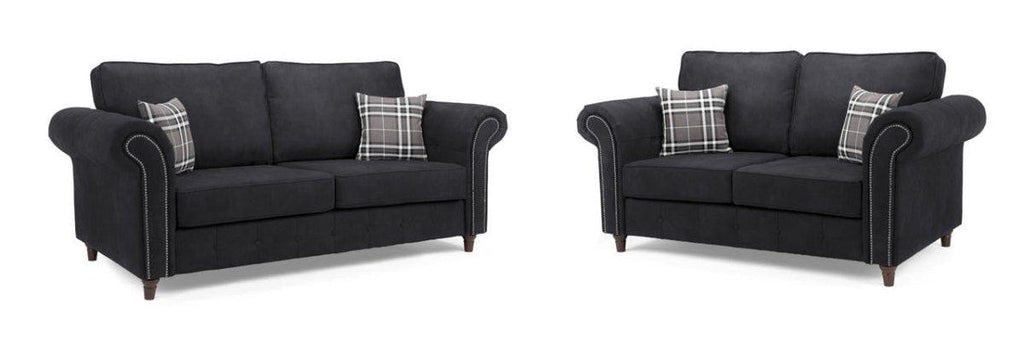 Black 3 and 2 seater sofa set with rolled arms, nailhead trim, and plaid accent cushions