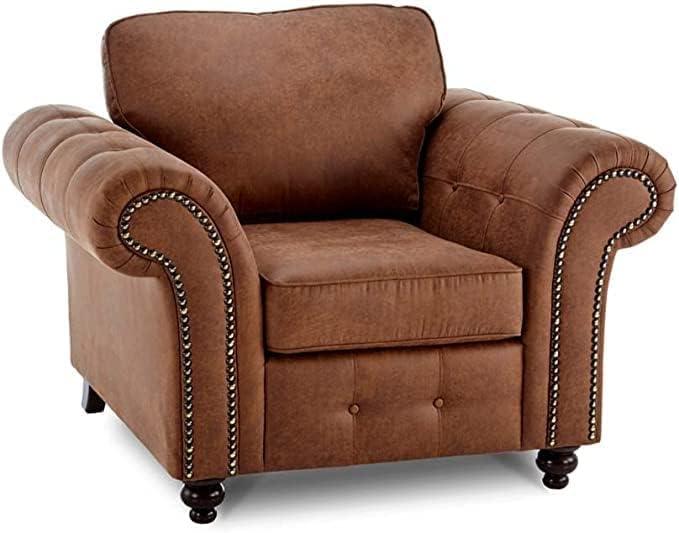 Brown leather armchair with rolled arms and studded detailing, classic one-seater sofa