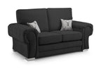 Black two-seater sofa with full back, silver legs, and two decorative stag cushions