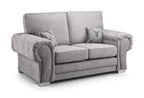 Light grey 2 seater sofa with plush cushions and two decorative stag pillows on white background