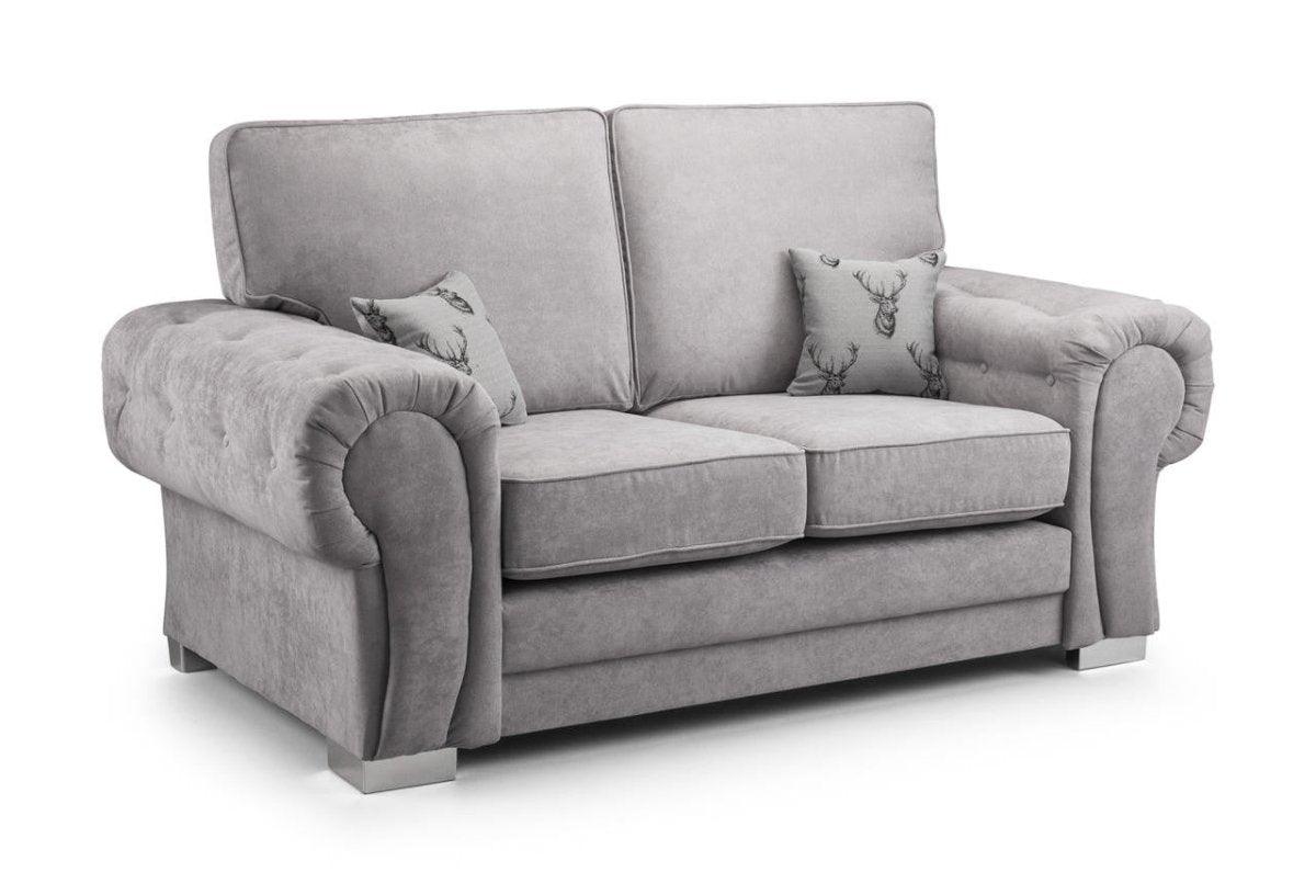 Light grey 2 seater sofa with plush cushions and two decorative stag pillows on white background