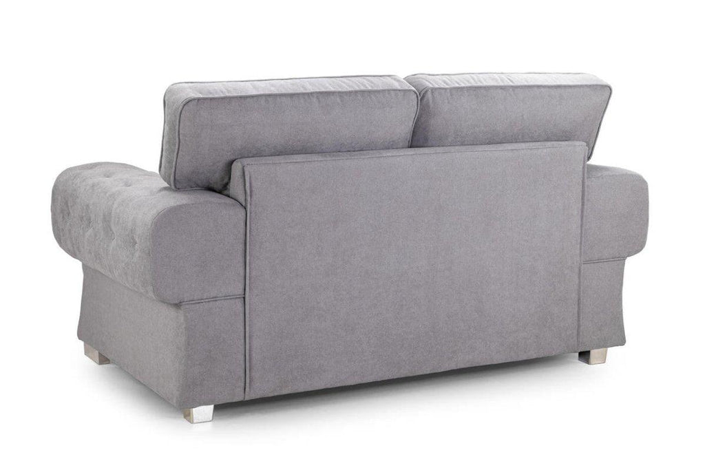 Back view of a modern grey two-seater fabric sofa with plush cushions and square legs