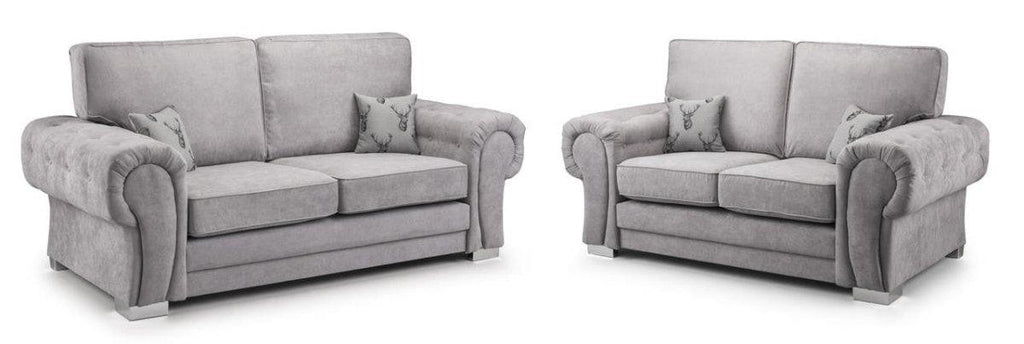 Modern grey velvet 3 and 2 seater sofa set with rolled arms and patterned accent pillows