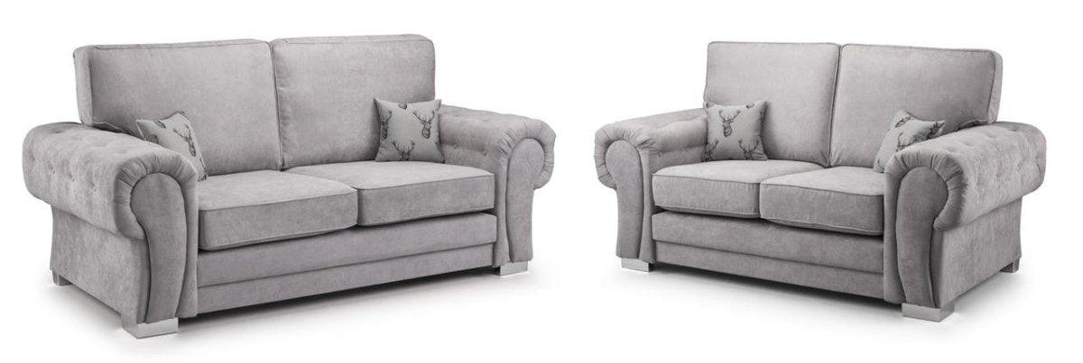 Modern grey velvet 3 and 2 seater sofa set with rolled arms and patterned accent pillows