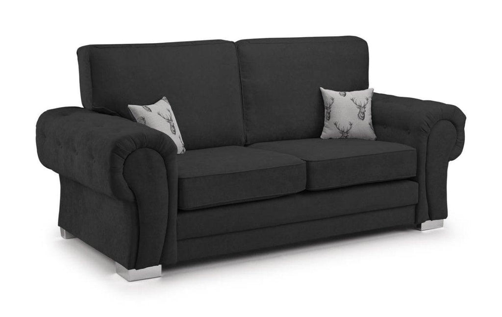 Modern black velvet 3 seater sofa with rolled arms, silver legs, and two deer print cushions