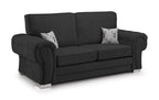 Modern black velvet 3 seater sofa with rolled arms, silver legs, and two deer print cushions