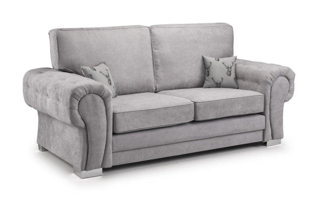 Light grey 3-seater sofa with plush rolled arms and two decorative deer-print accent pillows