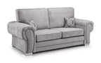 Light grey 3-seater sofa with plush rolled arms and two decorative deer-print accent pillows