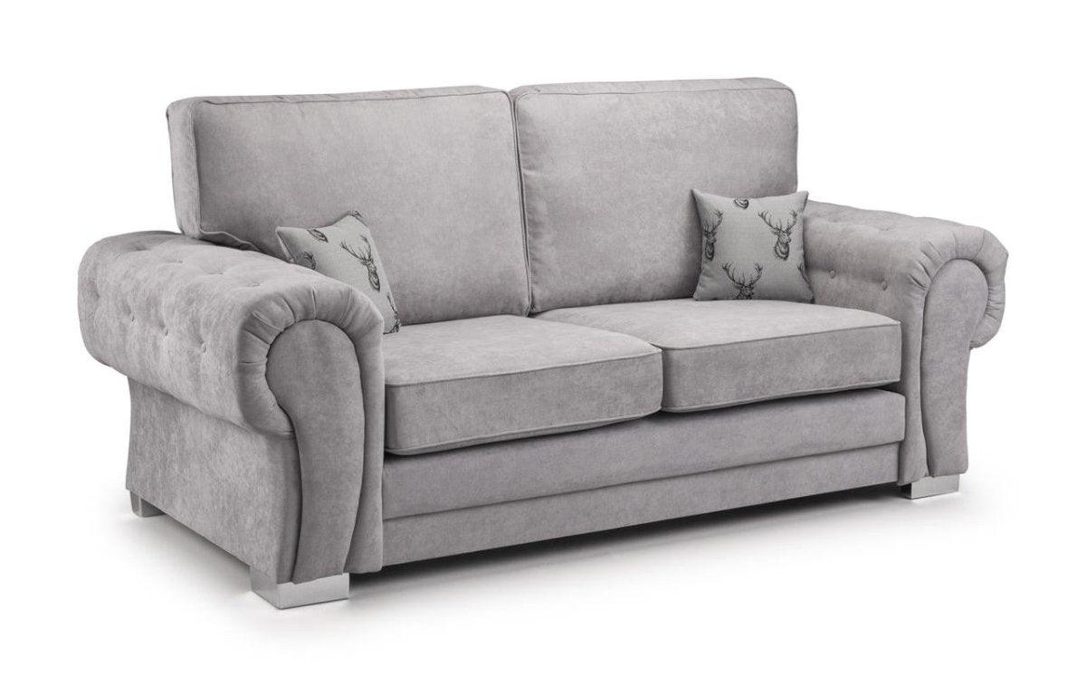 Light grey 3-seater sofa with plush rolled arms and two decorative deer-print accent pillows