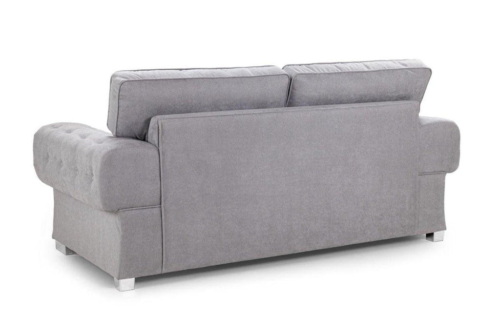 Modern grey fullback three-seater sofa with tufted arms and chrome legs, rear view