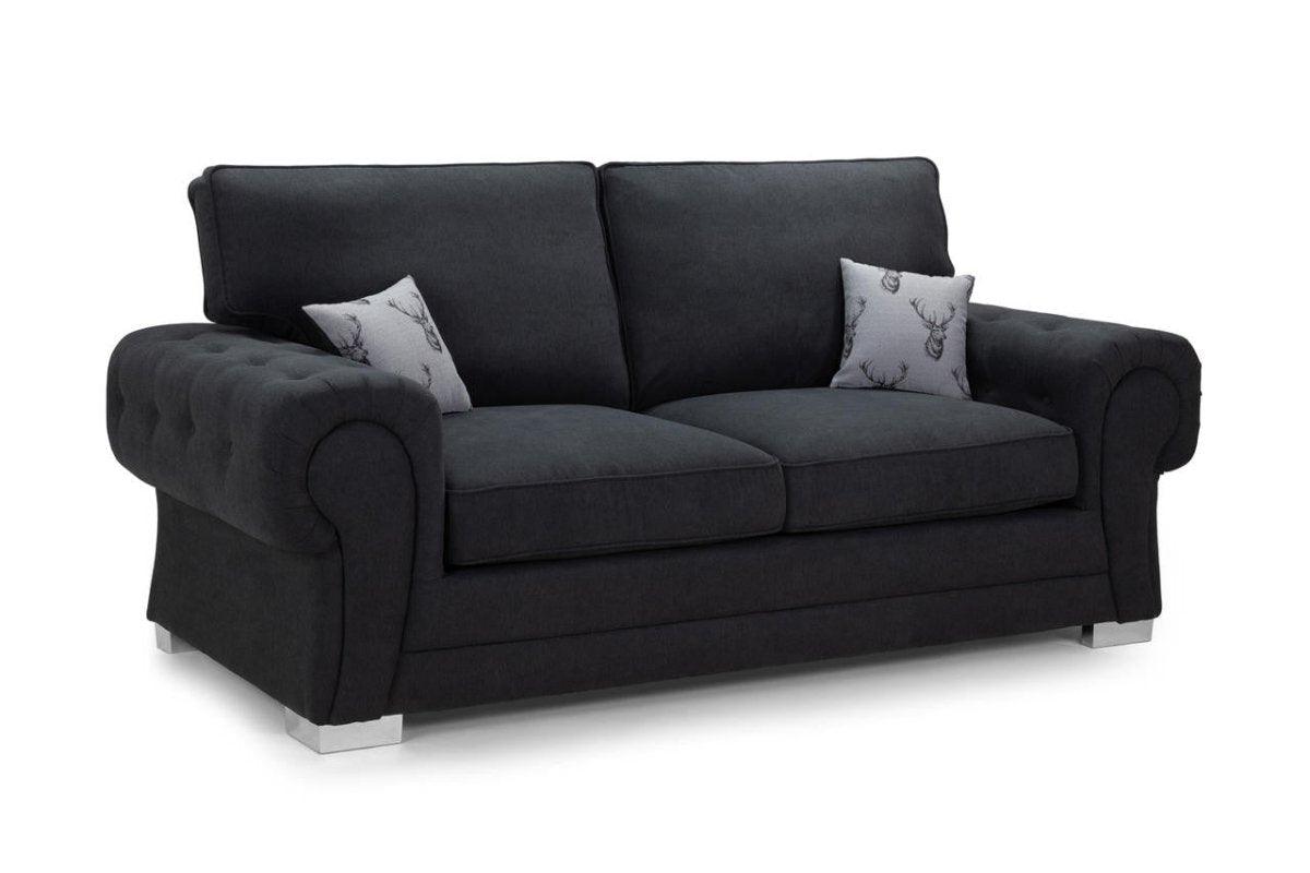 Black three-seater sofa bed with silver legs and two decorative cushions