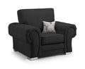 Black full-back armchair with plush rolled arms, silver legs, and a decorative stag pillow