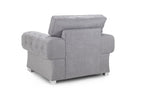 Modern grey fullback armchair with tufted upholstery and metal legs, rear view