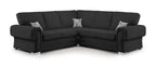 Black corner sofa with full back cushions and two printed accent pillows, modern style