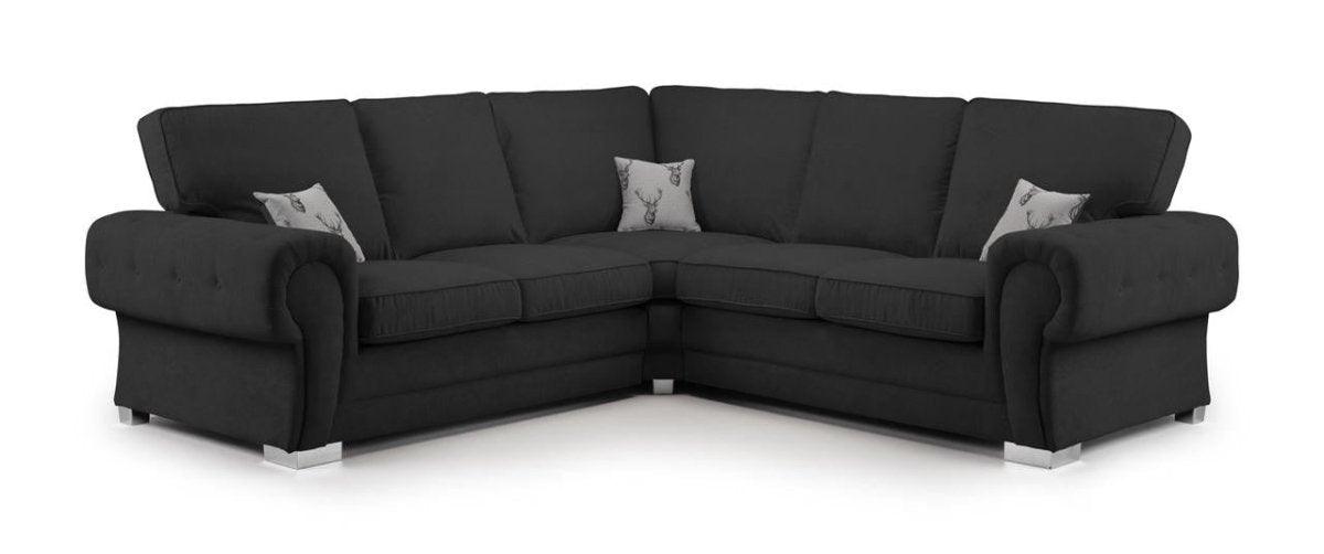 Black corner sofa with full back cushions and two printed accent pillows, modern style
