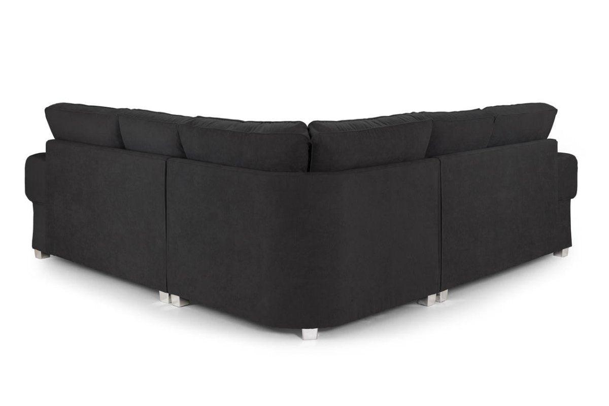 Modern black corner sofa with plush back cushions and metal legs, rear view on white background