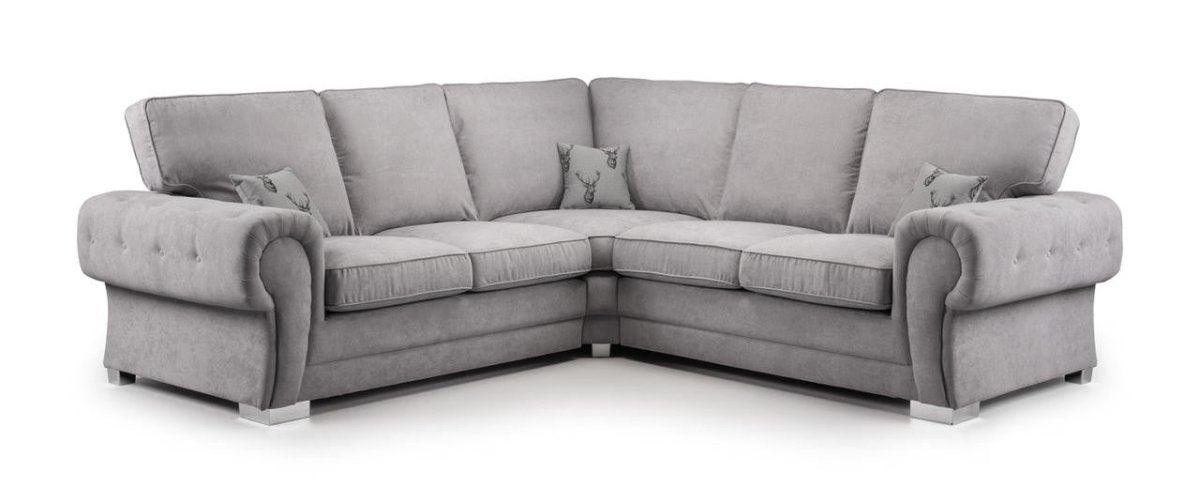 Grey corner sofa with full back cushions and rolled arms, includes matching throw pillows
