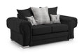 Black two-seater scatter back sofa with plaid and stag motif cushions on silver legs