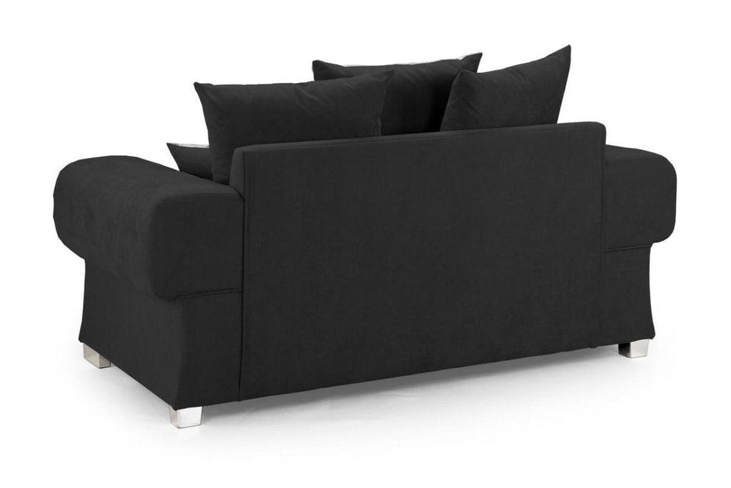 Black scatter back 2 seater sofa with plush cushions and chrome feet on white background